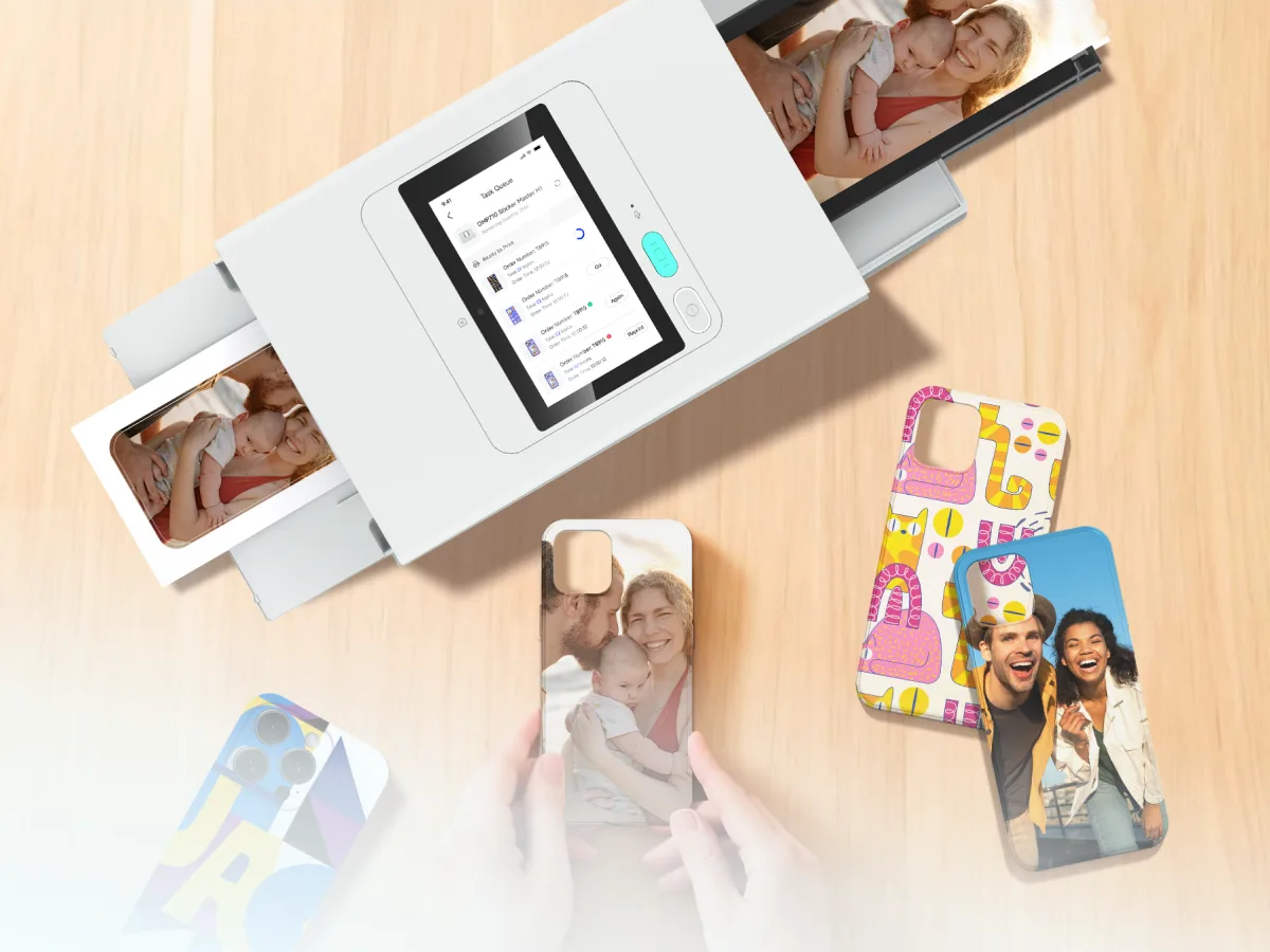 The machine on a counter beside phone backs printed with customers' own photos