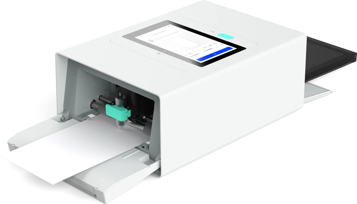 The Gegekoko DHP710, paper tray out and the cutting head visible inside